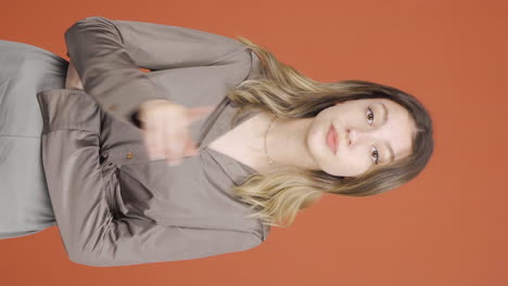 Vertical-video-of-Young-woman-getting-angry-at-camera.